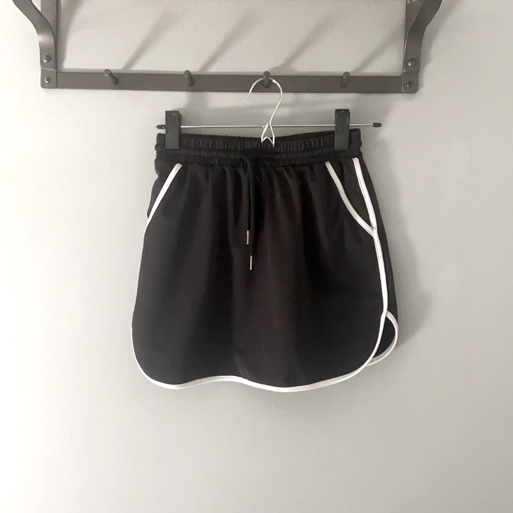 Black sporty mini skirt.